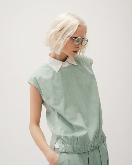 Green striped pleated tapered trousers