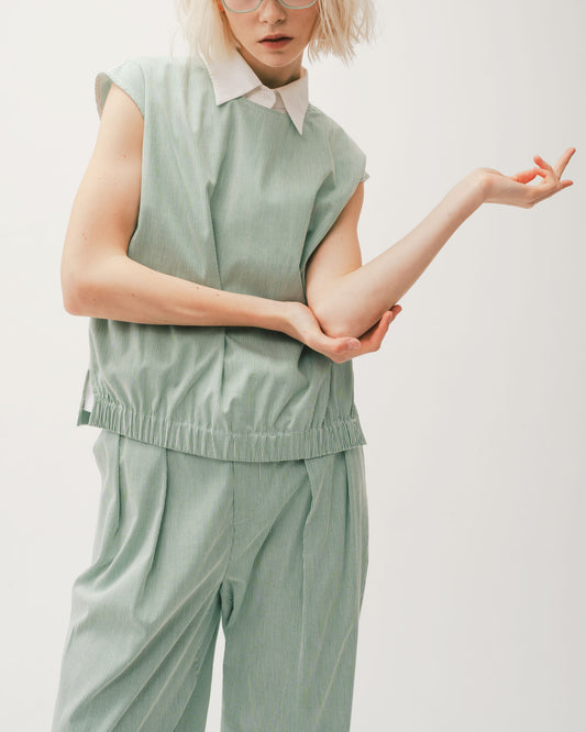 Green striped pleated tapered trousers