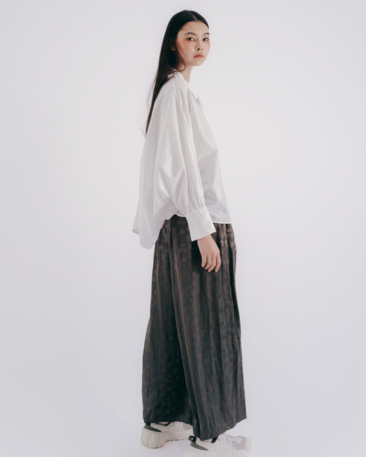 Wide-sleeved lace-up top with shimmering sleeves