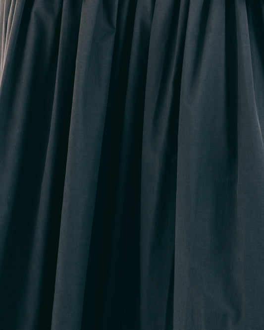 Textured black curved pleated skirt