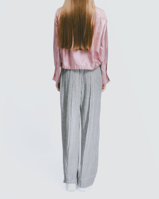 Off-white textured elastic draped trousers 