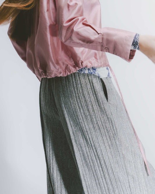 Off-white textured elastic draped trousers 